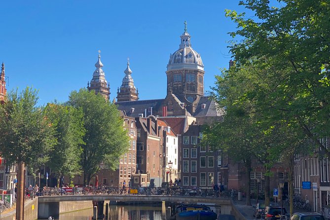 Absolutely Amsterdam - the Essential Introductory Walking Tour - Damrak and the Red Light District: The Holy, the Profane, and the Rules