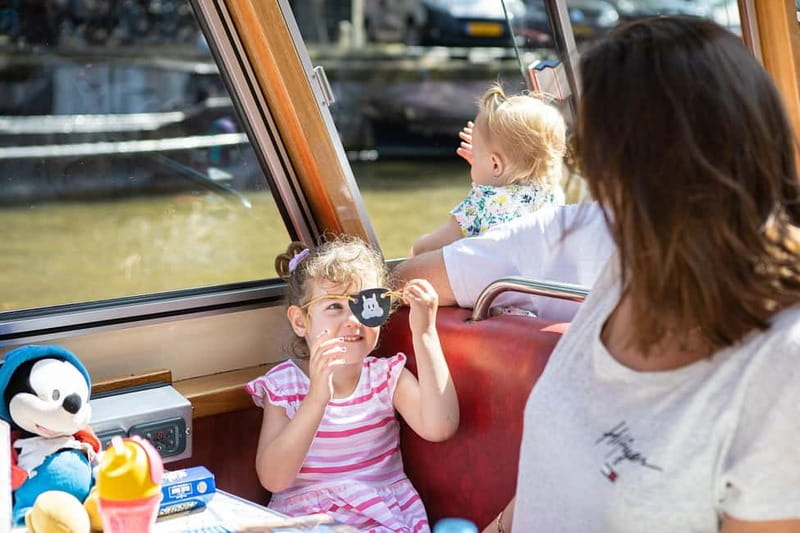Amsterdam: 75 Minute City Canal Cruise with Audio Guide - What the boat ride feels like, inside and out