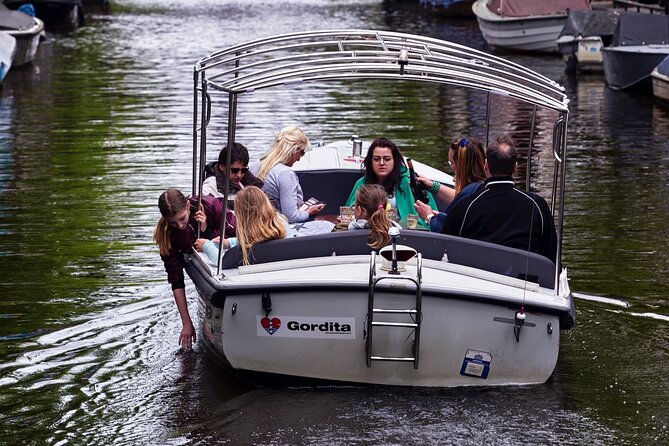 Amsterdam 90-min Private Canal Cruise with Live Guide and Drinks - Amstel, old beginnings and modern life side by side