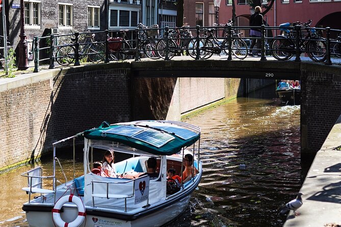 Amsterdam 90-min Private Canal Cruise with Live Guide and Drinks - Dancing Houses and the Monet canal: whimsy plus art history