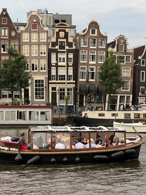 Amsterdam: Boat Tour with Optional Unlimited Drinks - Route walkthrough: starting at the Red Light District and cruising major landmarks