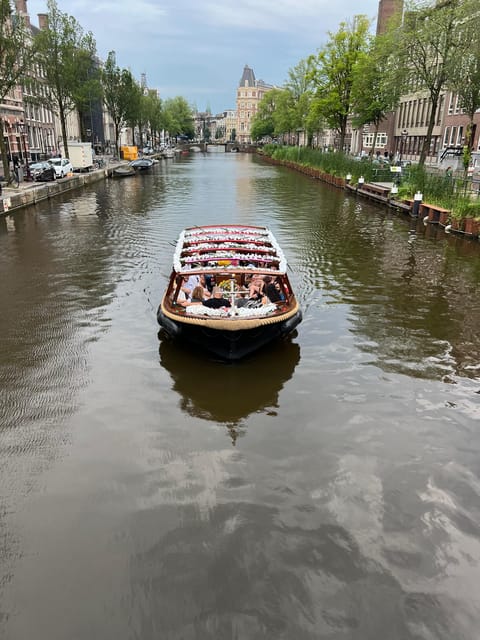 Amsterdam: Boat Tour with Optional Unlimited Drinks - The Enterprise boat setup: open deck views, glass roof comfort, and onboard mood lighting