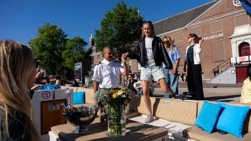 Amsterdam: Canal Cruise in Open Boat with Drink Option - Open-boat views with electric calm and honest guidance