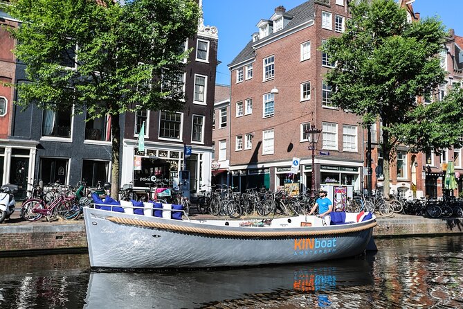 Amsterdam Canal Cruise in Open Boat with Unlimited Drinks Option - Cruising Past the Hermitage Museum and Through Canal Belt Views