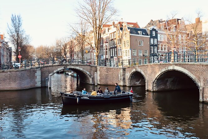 Amsterdam Canal Tour by Open Boat – 90 min Small Group Experience - Oudezijds Voorburgwal and the old district stories