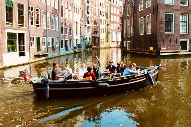 Amsterdam Canal Tour by Open Boat – 90 min Small Group Experience - Kolksluis, old locks, and warehouses that still look like 1700s Amsterdam