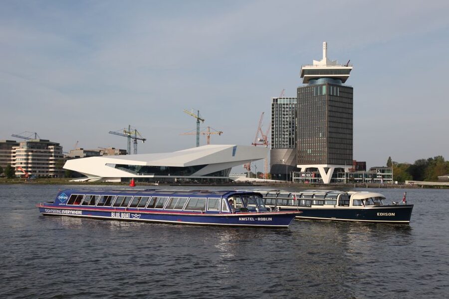 Amsterdam: City Canal Cruise & Straat Museum - Where You Board the Blue Boat: Two Docks and Two Tram Starts