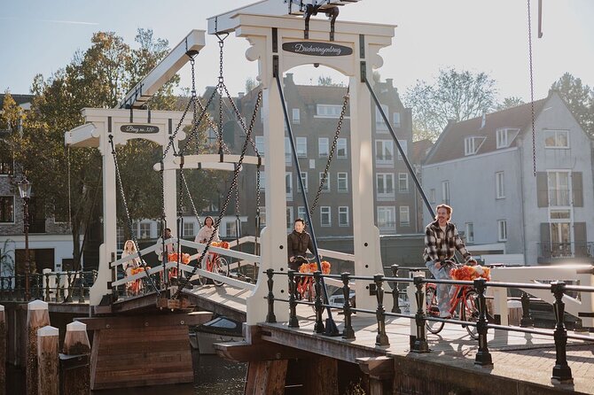 Amsterdam City Top Highlights Guided Bike Tour - Meeting at Nieuwezijds Voorburgwal, then riding the Amsterdam way