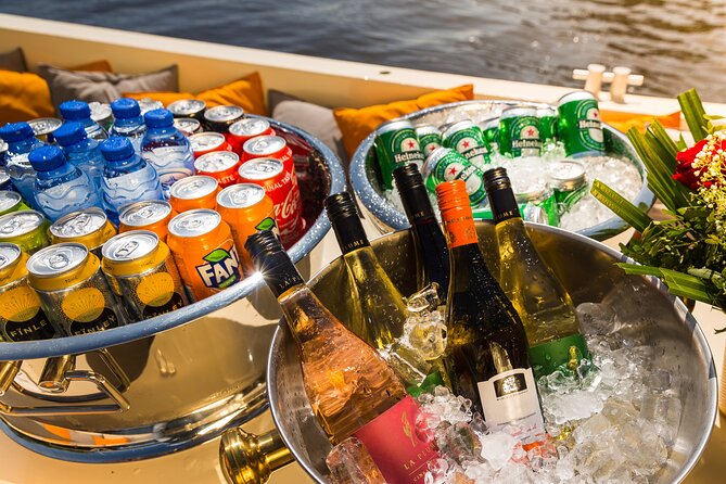 Amsterdam Classic Saloon Boat Canal Cruise with Live Guide - Cruising the Amstel River: The City’s Lifeline in Plain View