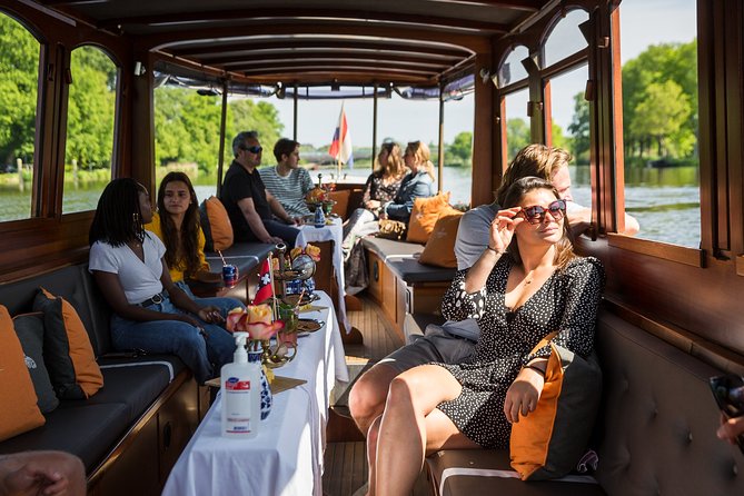 Amsterdam Classic Saloon Boat Cruise with Drinks and Cheese - Hearing the Stories: Sound, Crowds, and Where to Sit