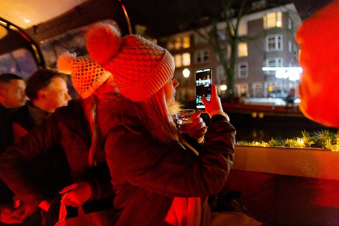 Amsterdam Evening Canal Cruise with Live Guide and Onboard Bar - Westerkerk, Carré, and the cultural corridor you pass after dark