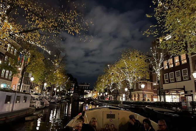Amsterdam Evening Cosy & Small Cruise & Drinks and Bites - Sunset - The boat experience: open-air views plus a quiet electric motor