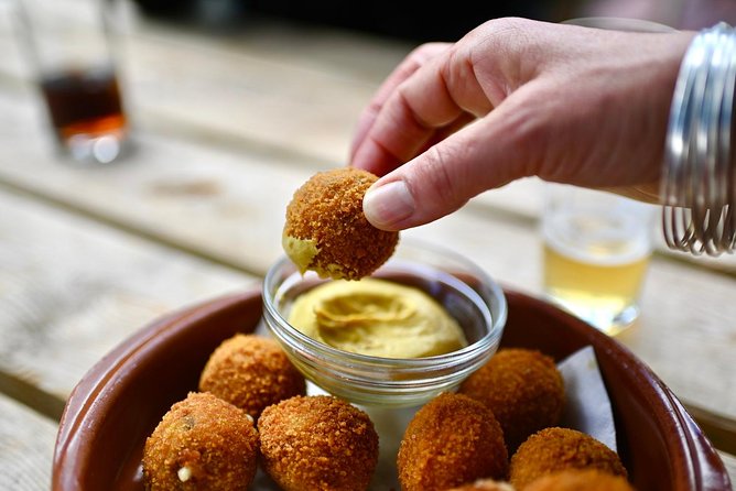 Amsterdam Food Tour of 10+ Local Classic Tastings in Jordaan Area - Comfort food middle stops: stamppot and bitterballen