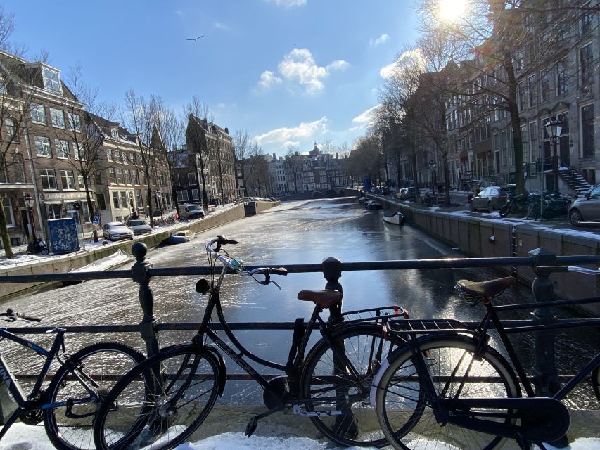 Amsterdam: Guided Off-The-Beaten-Track Walking Tour - Starting at Beursplein, getting your bearings the smart way