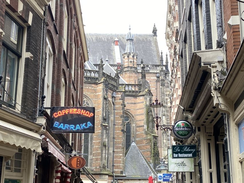 Amsterdam: Guided Off-The-Beaten-Track Walking Tour - Torensluis and the canal belt: why these waterways were built