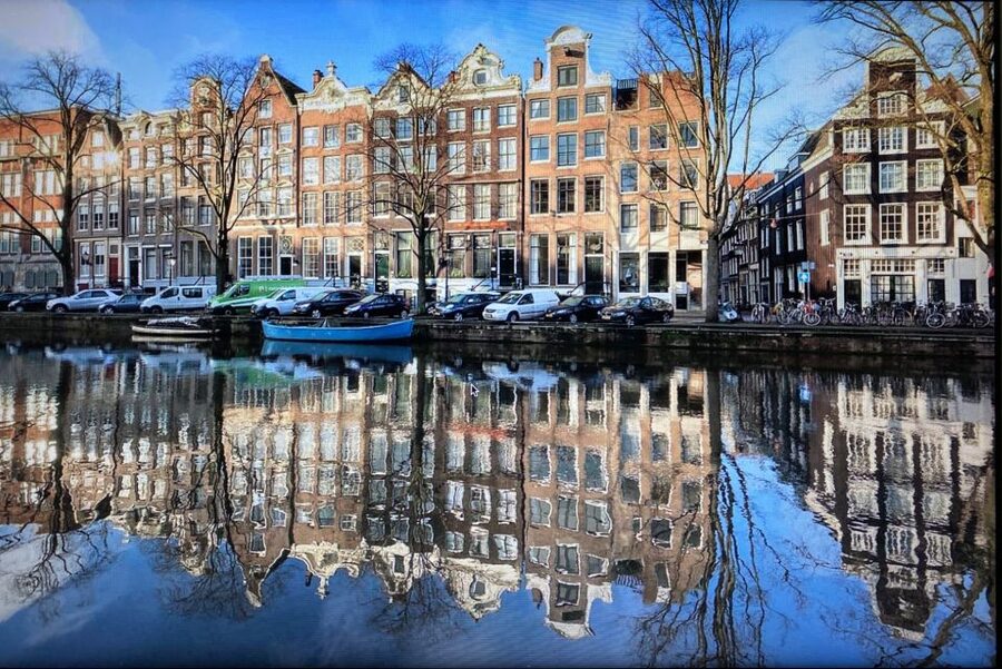 Amsterdam: Guided Off-The-Beaten-Track Walking Tour - Noordermaarkt: using a market stop to taste local Amsterdam
