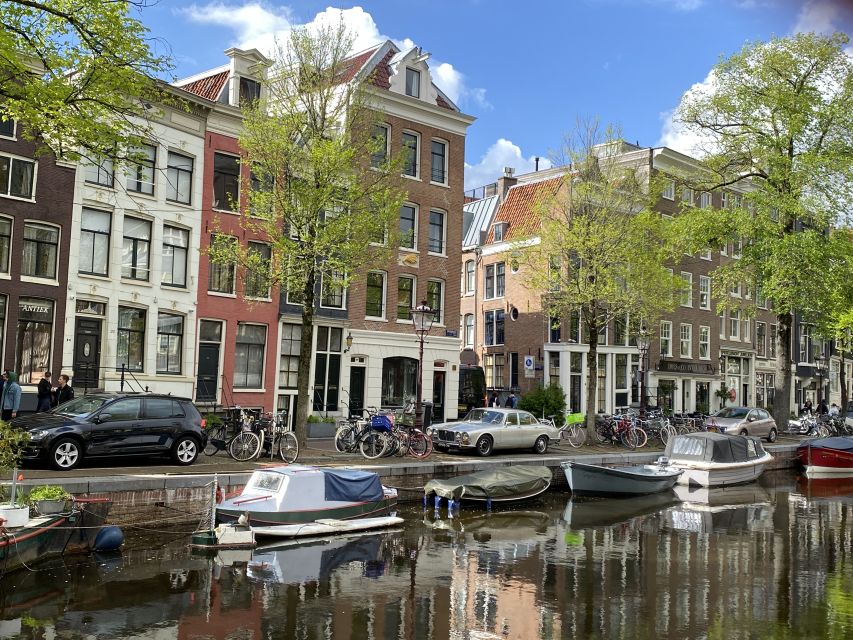Amsterdam: Guided Off-The-Beaten-Track Walking Tour - Dam Square essentials: Royal Palace, National Monument, and Nieuwe Kerk