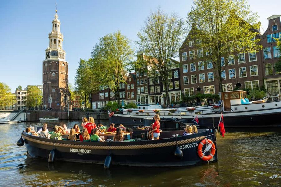 Amsterdam: Guided Open Boat Canal Cruise Including Drink - Drinks onboard: included sip versus unlimited open bar