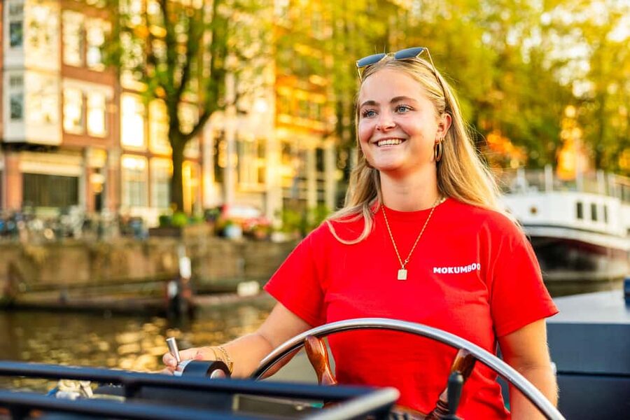Amsterdam: Guided Open Boat Canal Cruise Including Drink - Should you book this Amsterdam canal cruise?
