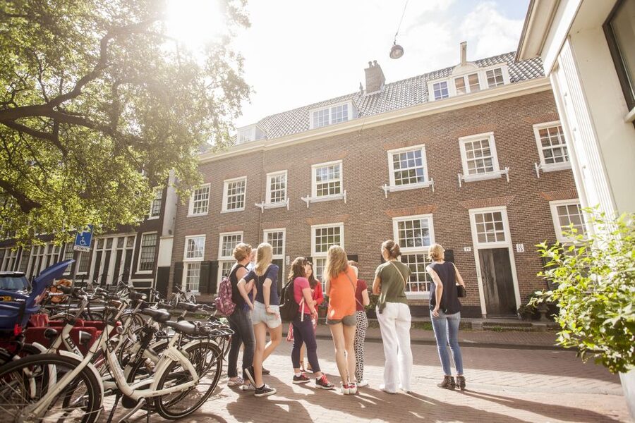 Amsterdam: Hidden Gems & Highlights Guided Bike Tour - Getting Started: Bike Rental, Small Group, and an English Guide