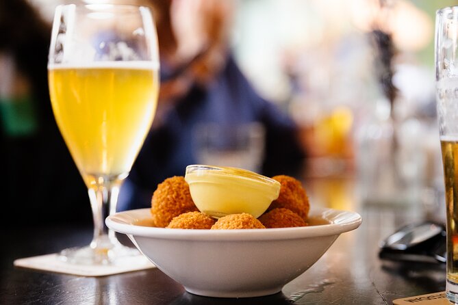 Amsterdam High-End Dutch Food & History Tour - Up to 8 guests - Fish Shop Time: Herring, Fried Cod, and Smoked Eel
