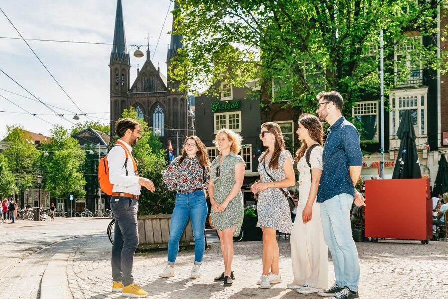 Amsterdam: Historical Highlights Walking Tour with Tasting - Rain or shine logistics: what to wear and how to plan
