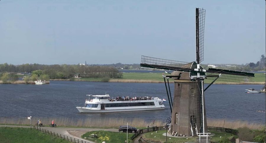 Amsterdam: Keukenhof, Tulip Farm Full-Day Tour with Cruise - Kagerplassen windmill cruise, 1 hour of Dutch speed control