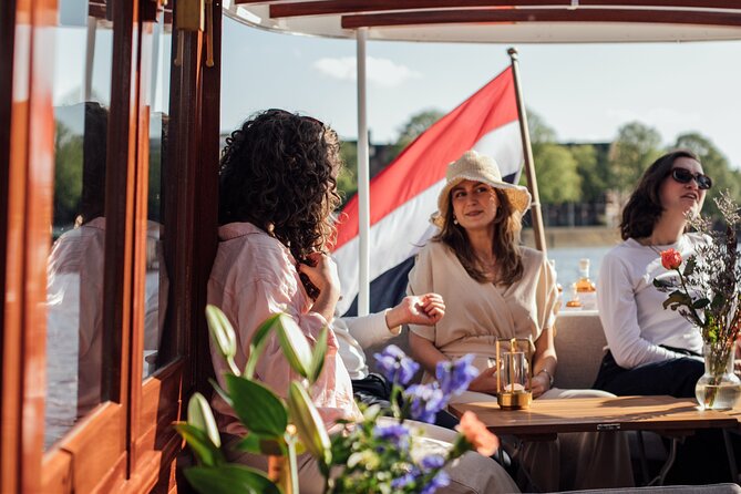 Amsterdam: Luxury Saloon Boat Cruise with Cocktails & Waffle - Kolksluice and the Canal Lock That Kept the Water Clean
