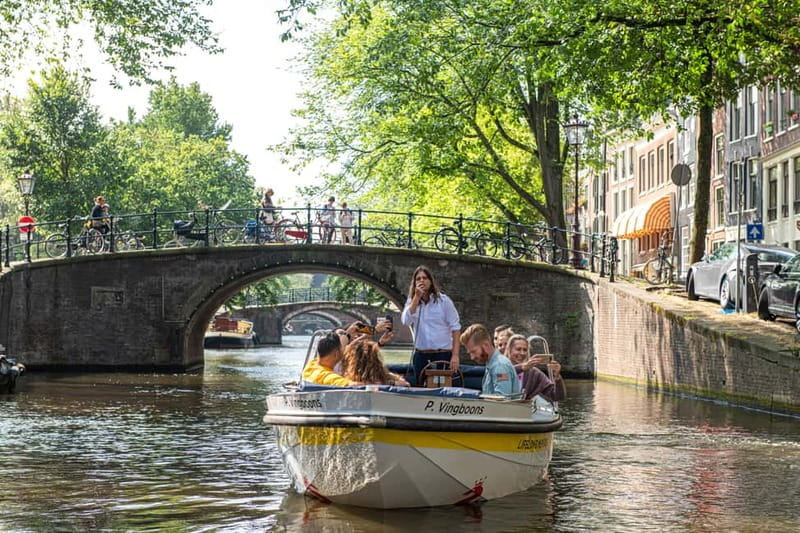 Amsterdam: Open Boat Tour of Canals with Expert Local Guide - Where you meet matters, and Damrak is the easiest starting point