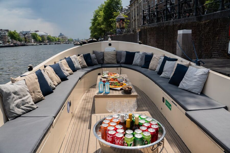 Amsterdam: Private Canal Booze Cruise with Unlimited Drinks - Private booze cruise on the Amstel, with real canal views