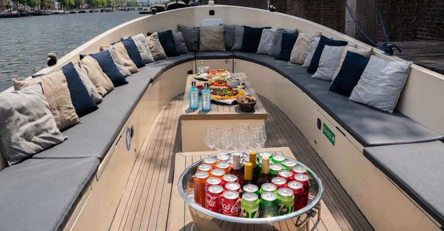 Amsterdam: Private Canal Booze Cruise with Unlimited Drinks - The route: Red Light District, NEMO, and the canal classics