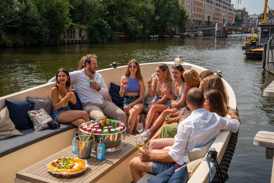 Amsterdam: Private Canal Booze Cruise with Unlimited Drinks - Open bar specifics: beer, wine, soda, and how to order smart