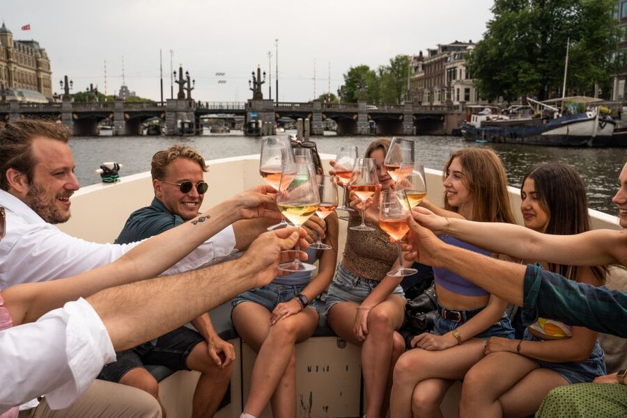Amsterdam: Private Canal Booze Cruise with Unlimited Drinks - Guides, skipper, and group energy that actually works