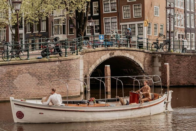 Amsterdam: Private Romantic Canal Cruise w. Prosecco/Snacks - What you’ll see: canals, 17th-century façades, and the Seven Bridges of Love