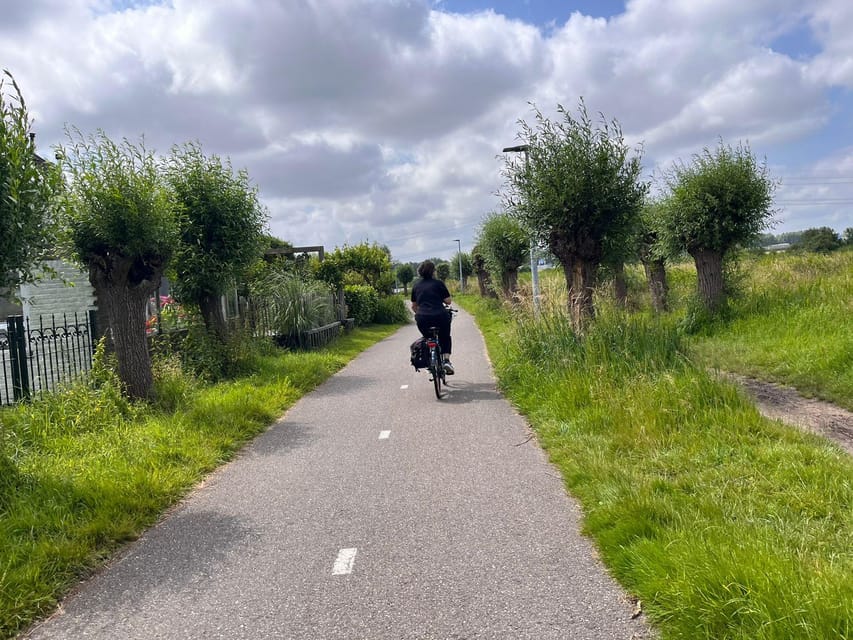 Amsterdam: Rainbow Rural Bike Tour With Local Gay Guide - Polders, dykes, and panoramic views on a flat, easy ride