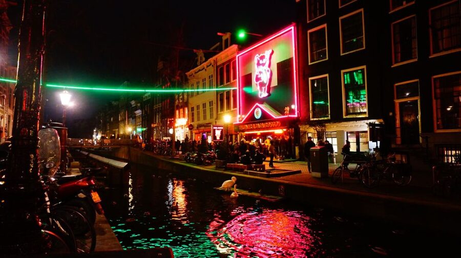 Amsterdam: Red Light District Exclusive Night Tour - Oude Kerk First: The Oldest Building Area Sets the Tone