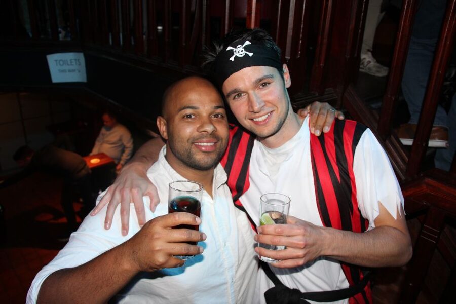 Amsterdam: Red-Light District Pub Crawl and Booze Boat Tour - The Key Time Window: Unlimited Shots from 8:00 PM to 8:30 PM