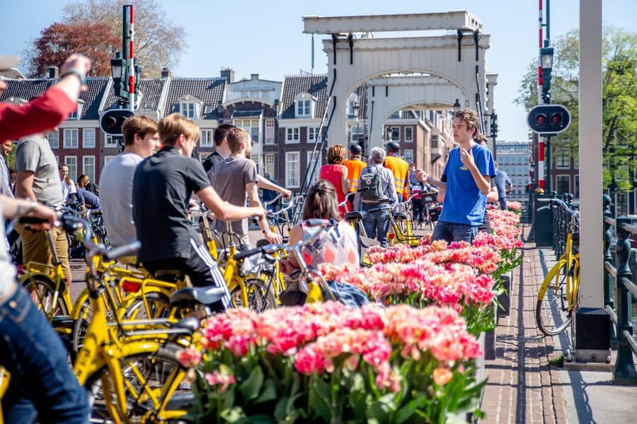 Amsterdam: Relaxed City Highlights Guided Bike Tour - P.C. Hooftstraat and the Magere Brug, skinny love bridge photos with context