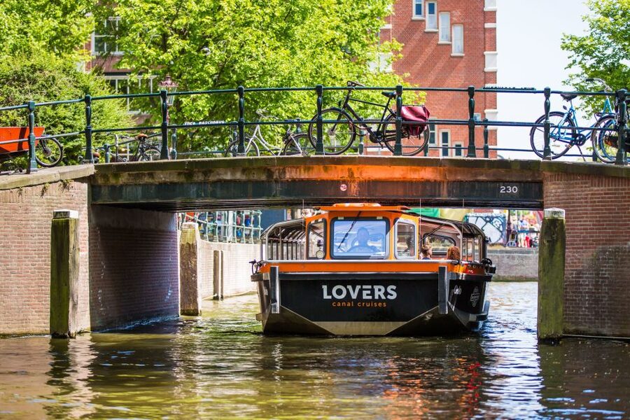 Amsterdam: Semi-Open Canal Boat Cruise - Entering Amsterdam from the water, step by step