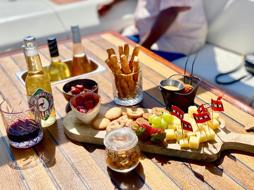Amsterdam Small Group Canal Cruise inc Snacks/Drinks Winter - Heated sloop comfort: better visibility than the big boats, plus real warmth