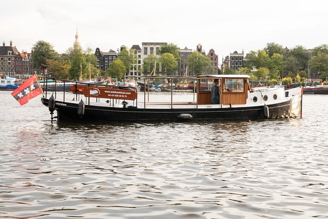 Amsterdam Small-Group Canal Cruise With Dutch Snacks and Drink - The canal belt, the Jordaan, and getting the “neighborhood map” from the water