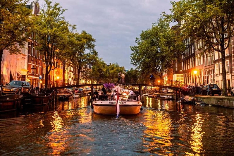 Amsterdam: The Bulldog Boat Smoke and Booze Cruise - Weather and comfort tips for a half-open boat night