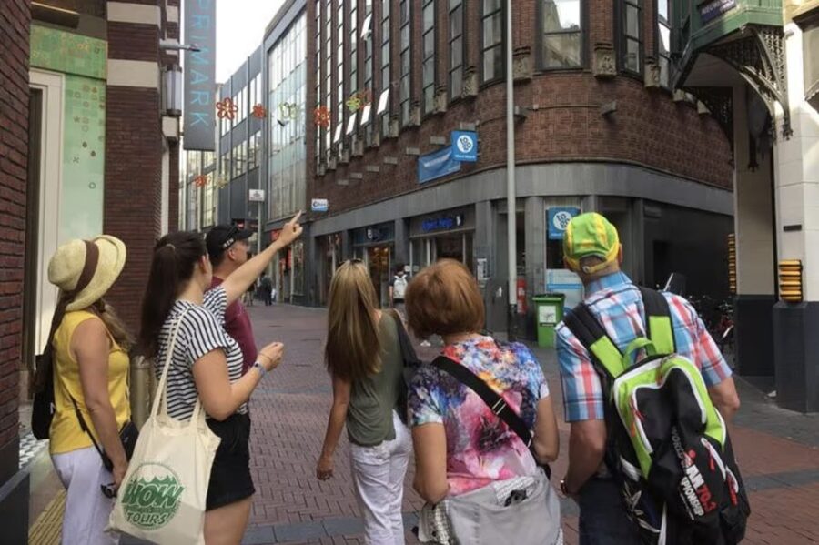 Amsterdam: The Story of History & Culture Walking Tour - Spotting Historic Buildings and Learning What to Photograph