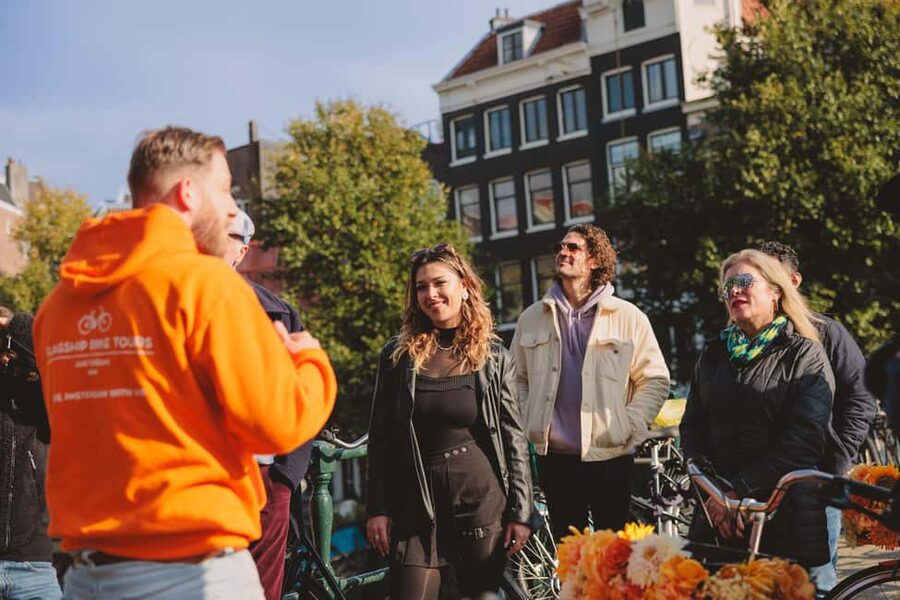 Amsterdam: Top Highlights Guided Bike Tour EN/DE/ES/FR/IT/CN - Leidse Square Food Stop: A Short Taste of Local Life