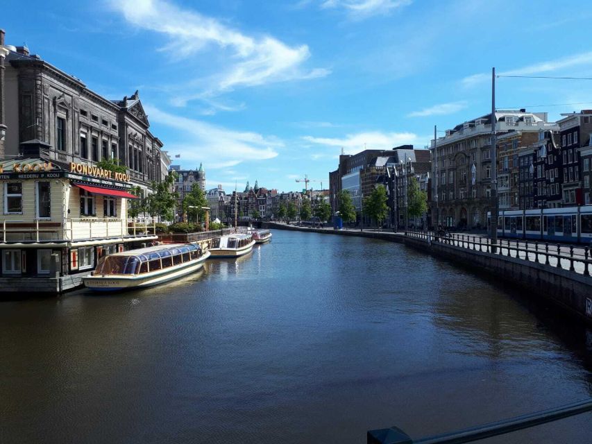 Amsterdam Walking Tour and Canal Cruise - The canal cruise payoff, 60 minutes of UNESCO-water views