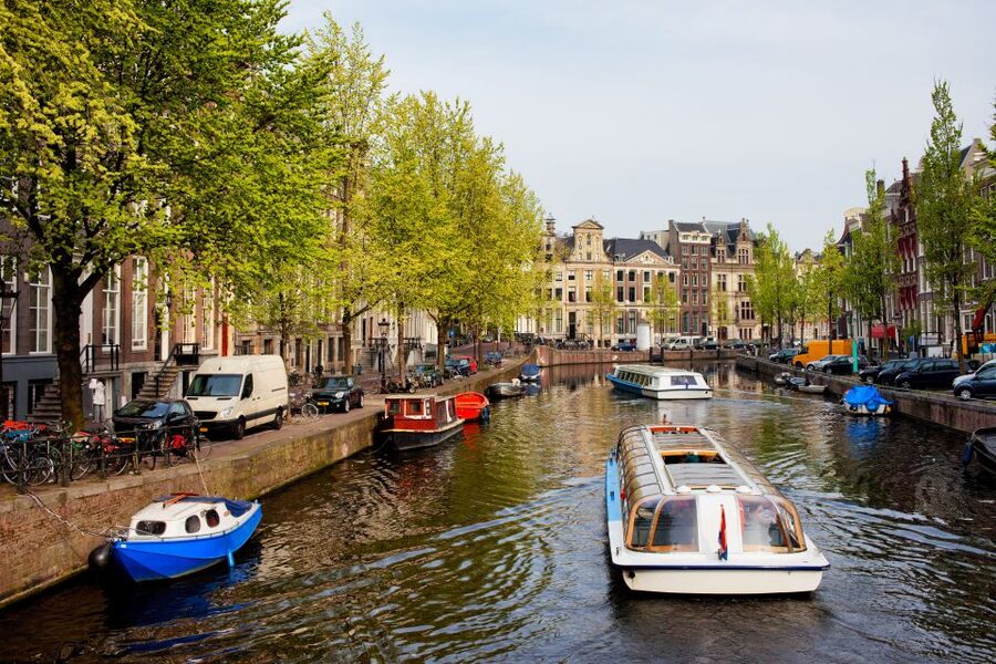 Amsterdam Walking Tour and Canal Cruise - Dam Square and the West Church area, big landmarks with real context