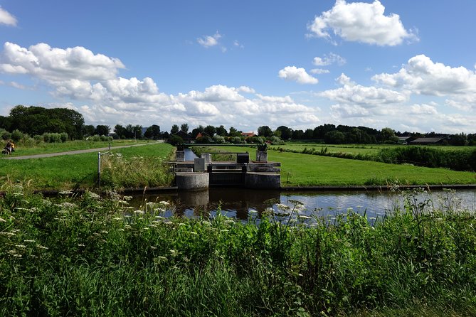 Countryside Bike Tour from Amsterdam: Cheese, Clogs & a Windmill - Rolling along the IJ River, then crossing by ferry