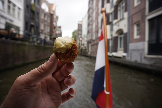 Eating Amsterdam: Food Tour & Canals Cruise - Vishandel Centrum fish: herring and kibbeling in a real open-kitchen fish shop