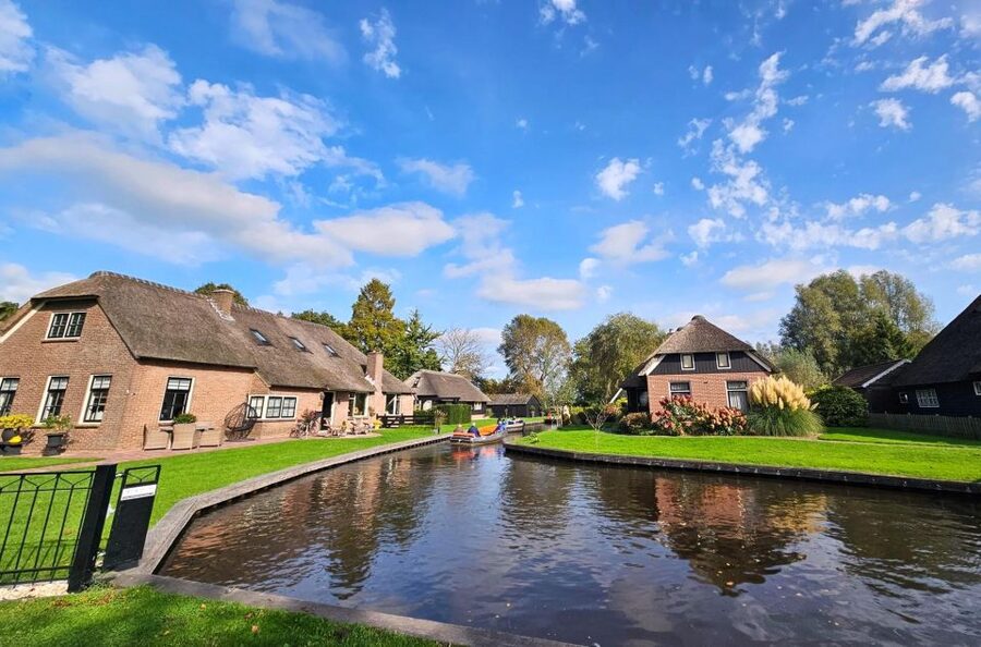 From Amsterdam: Giethoorn & Zaanse Schans Tour w/ Small Boat - The short IJsselmeer pass: a quick Northern look from the road