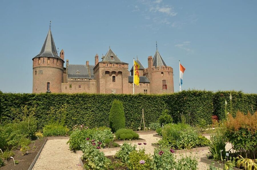 From Amsterdam: Muiderslot and De Haar Castle Tour - Gardens to prioritize: maze paths, deer park, rose garden, and a covered bridge